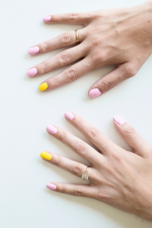 Someone with pink and yellow nails