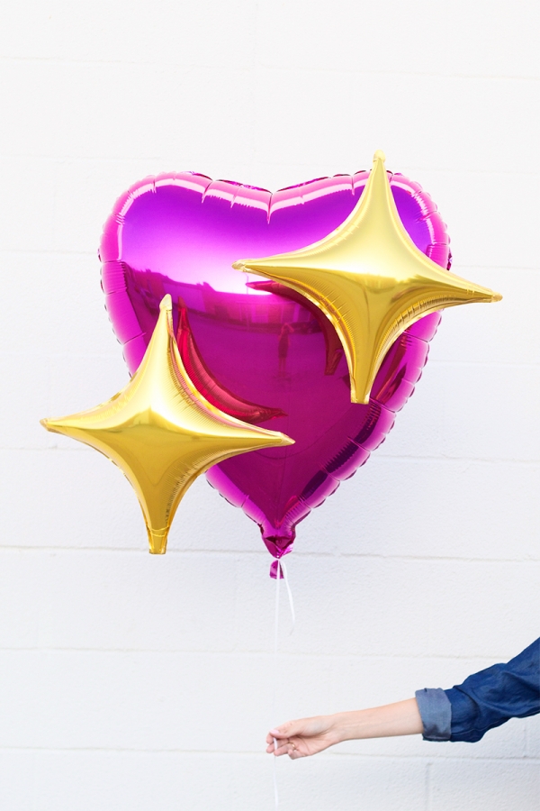 Pink heart and star emoji balloon
