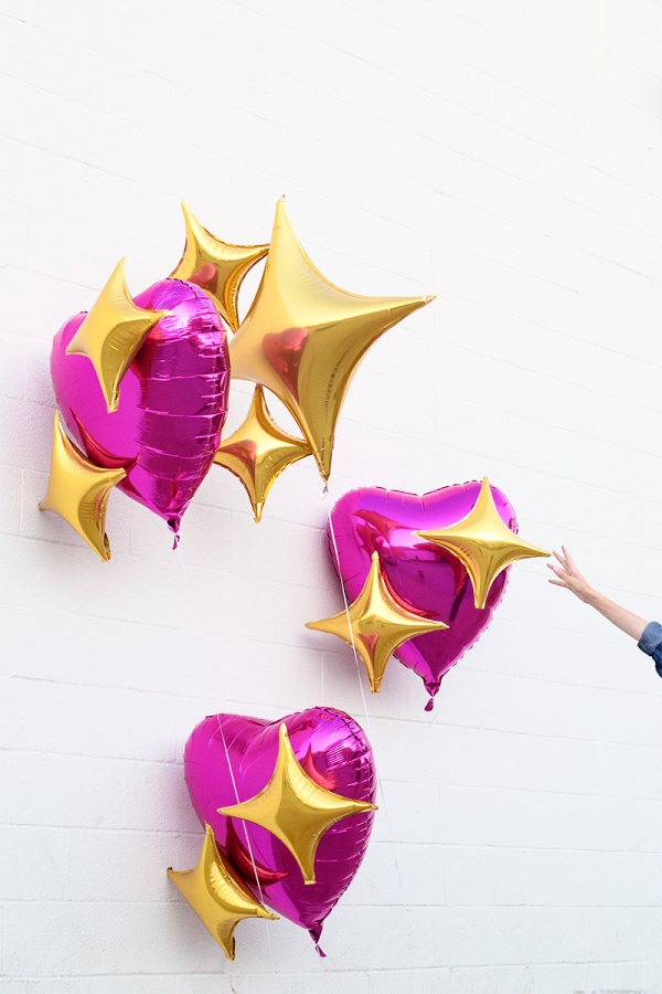 Pink heart and star emoji balloons