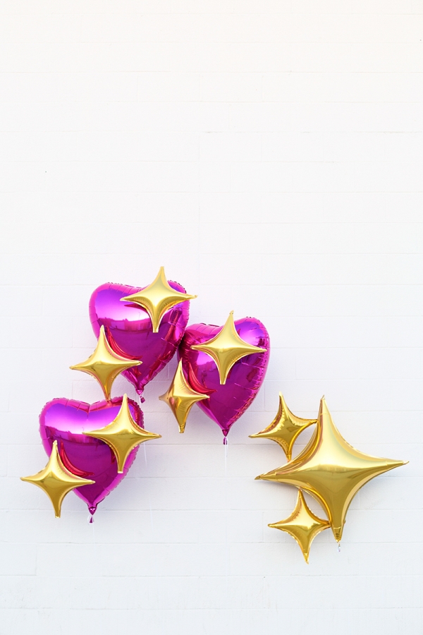 Pink heart and star emoji balloons