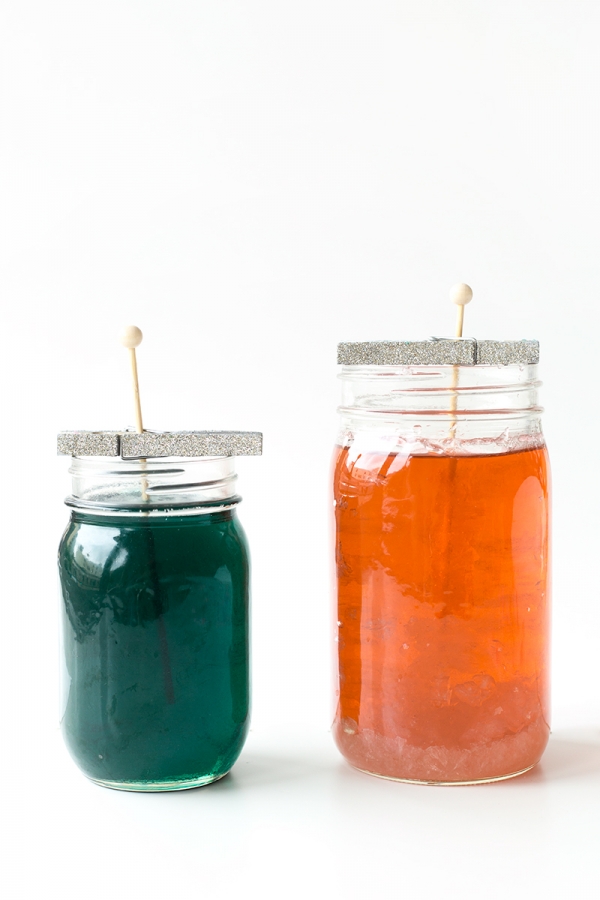 Two jars with colorful liquid in it