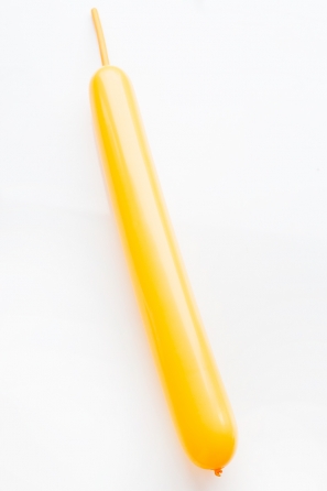 Close up of yellow long balloon