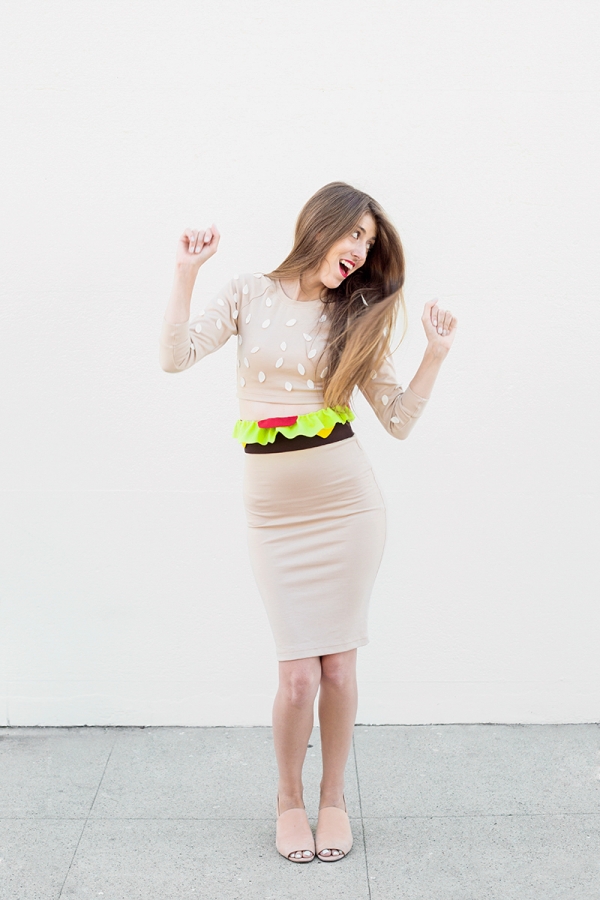 A woman wearing a burger costume 