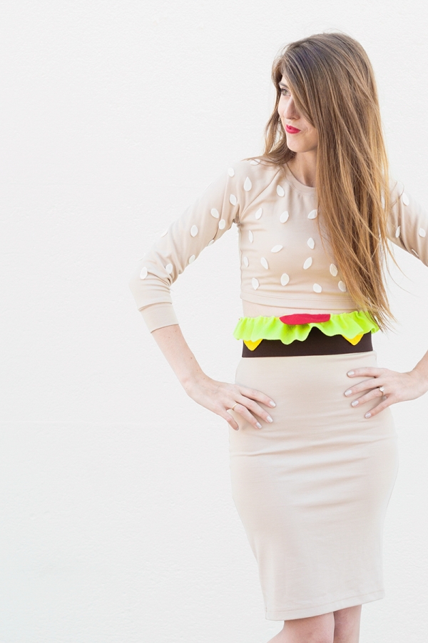 A woman wearing a burger costume 