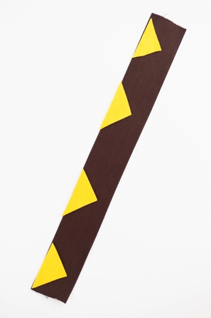 A close up of a black and yellow paper