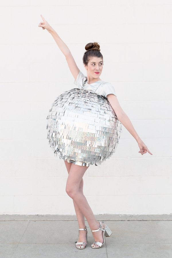 A woman dressed as a disco ball