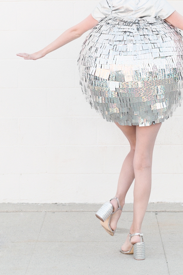 A woman dressed as a disco ball