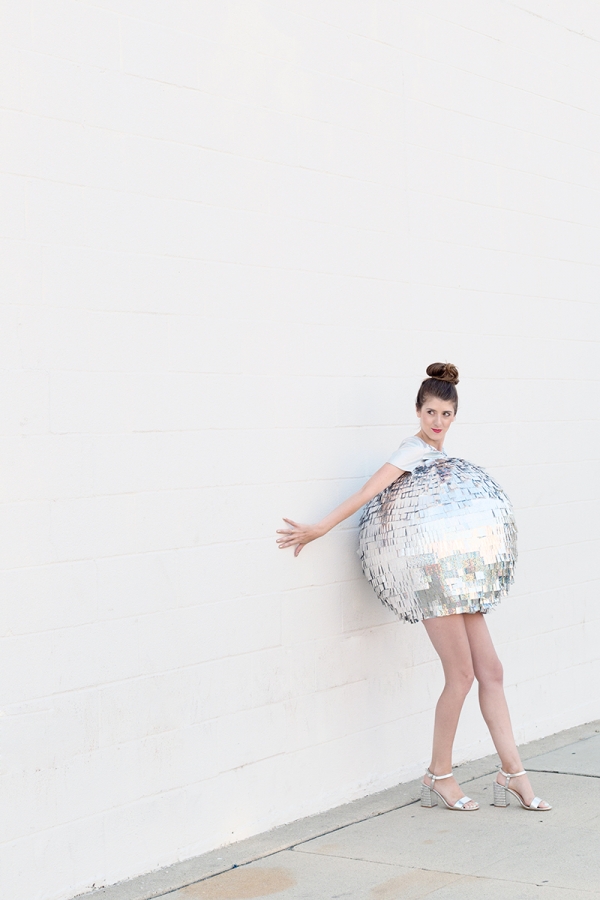 A woman dressed as a disco ball