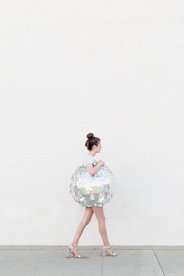 A woman dressed as a disco ball