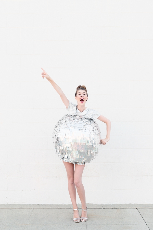 A woman dressed as a disco ball