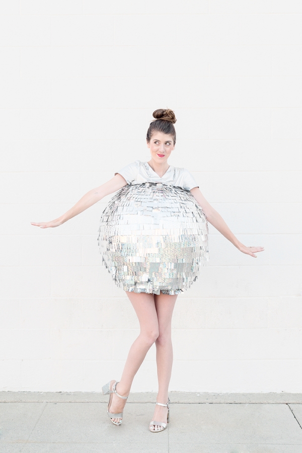 A woman dressed as a disco ball