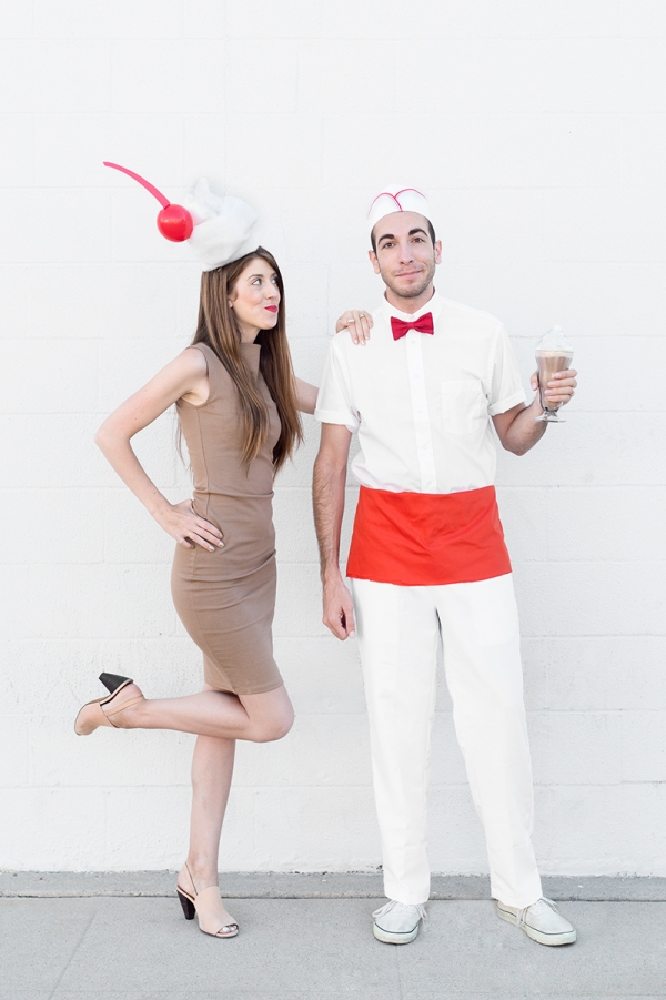 A woman dressed as a milkshake and a man dressed as a milk man 