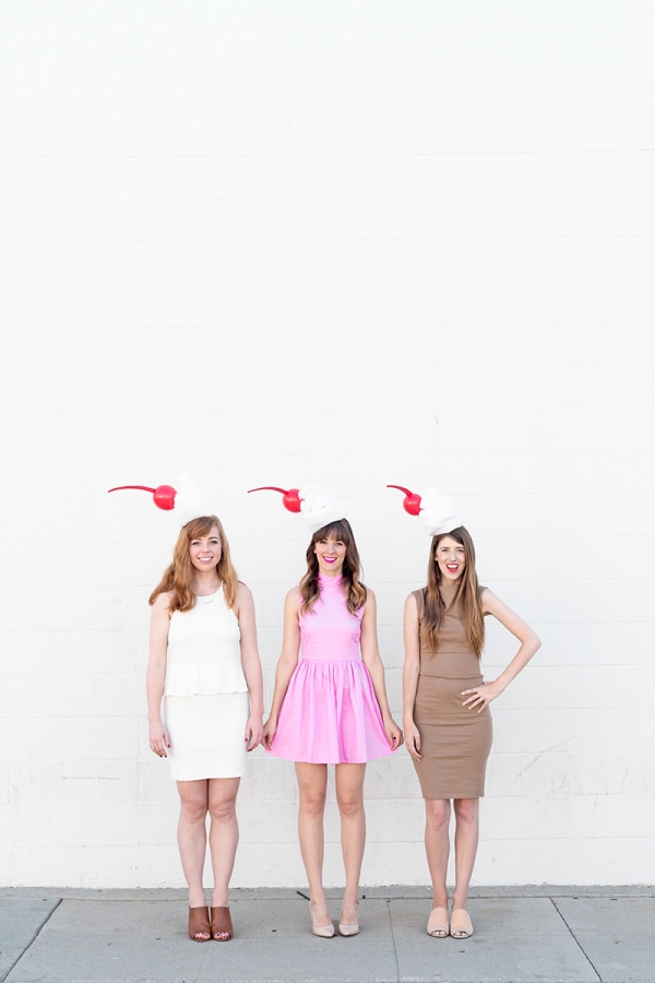 Three girls dressed in milkshake costumes