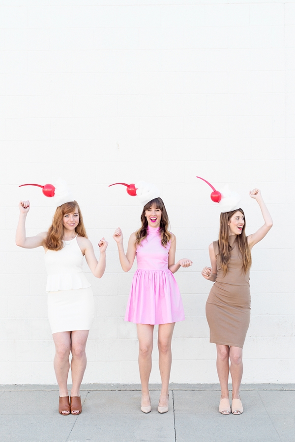 Three girls dressed in milkshake costumes