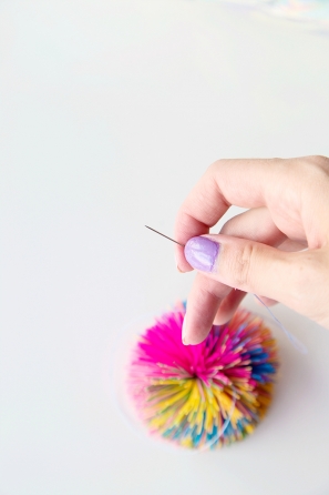 Someone holding a tiny pin