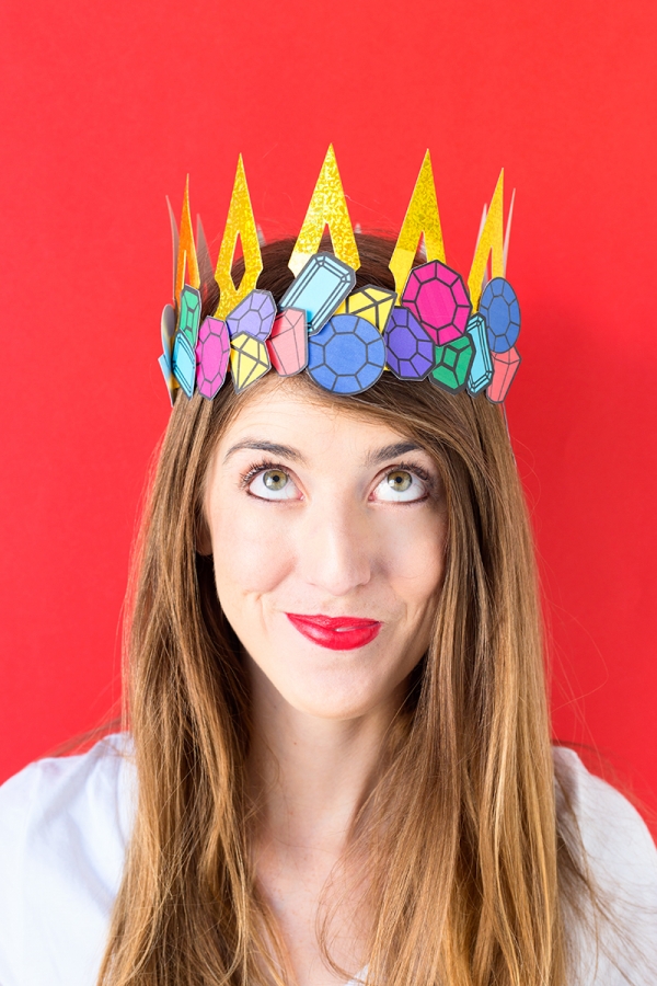 A woman wearing a paper crown