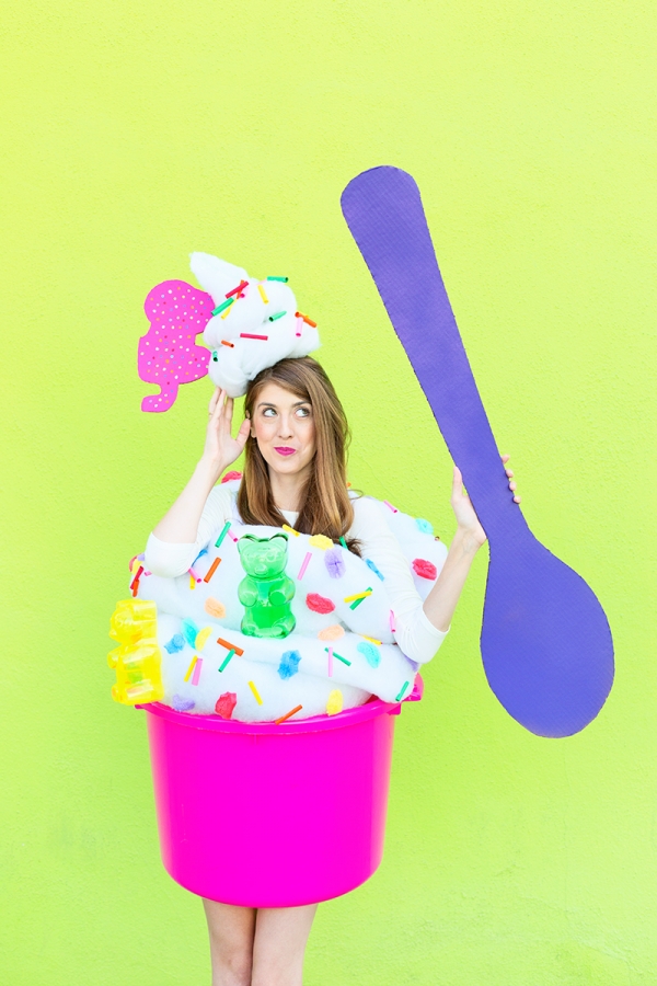 A woman dressed in a froyo costume 