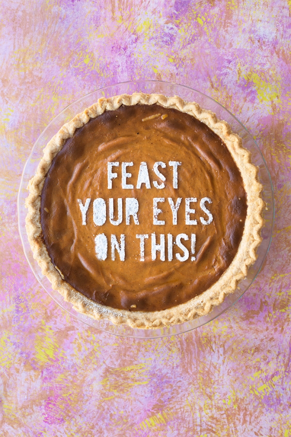 Pie that says \"feast your eyes on this!\"