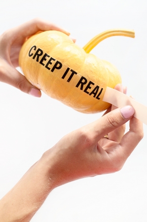 A pumpkin with words on it