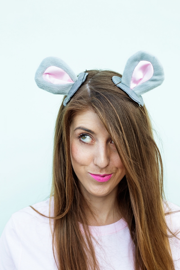 A woman wearing rat ears
