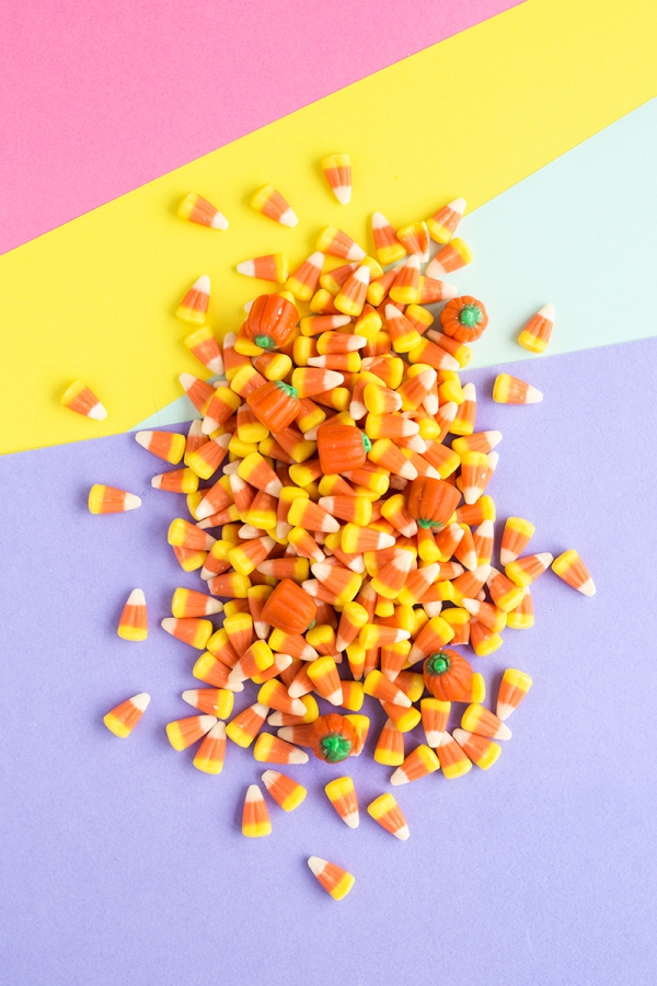 Candy corn on a colorful surface 