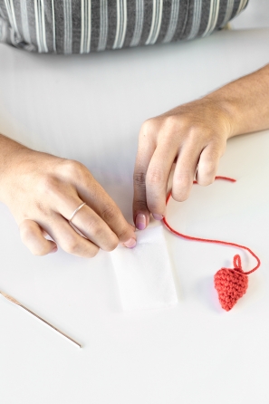 Someone sewing an item