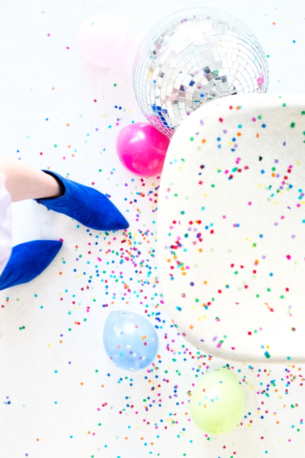 A chair with colorful dots and balloons