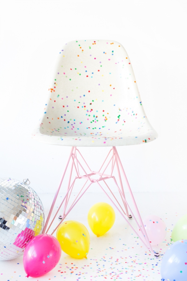 A chair with colorful dots and balloons