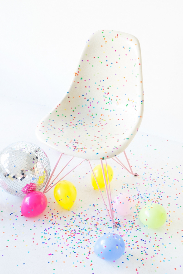 Chair with colorful dots on it and balloons