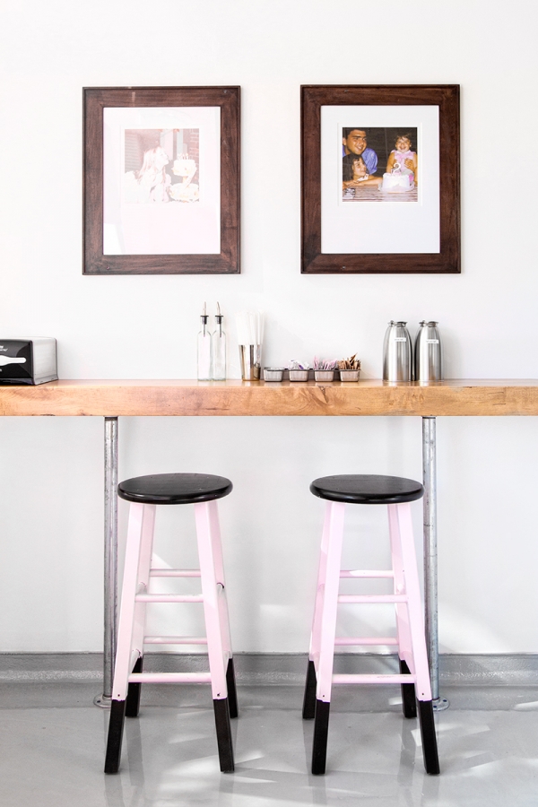 A table with pink stools