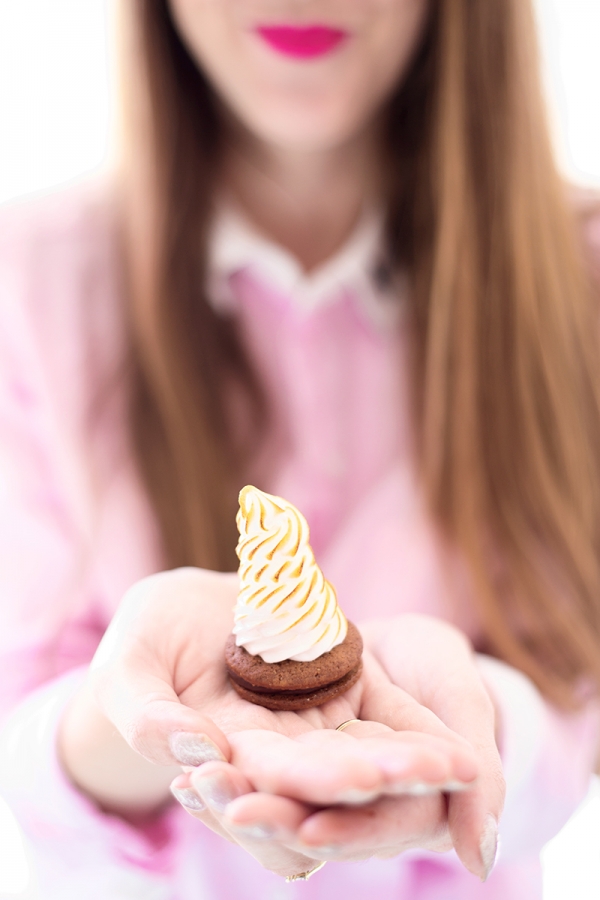 Someone holding a mini cupcake