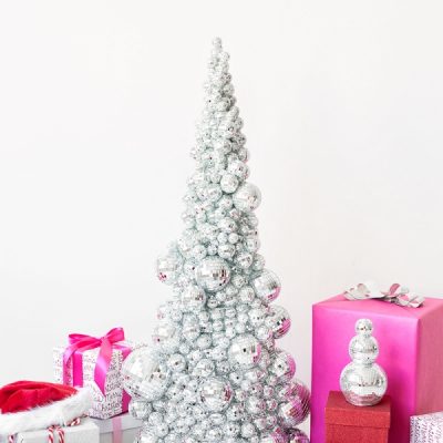 A silver Christmas tree and pink presents