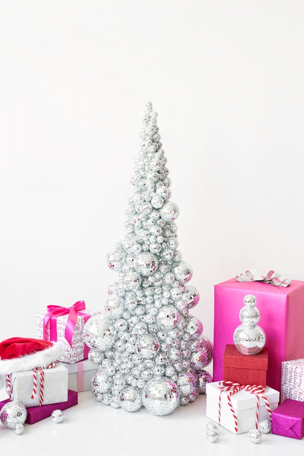 A silver Christmas tree and pink presents