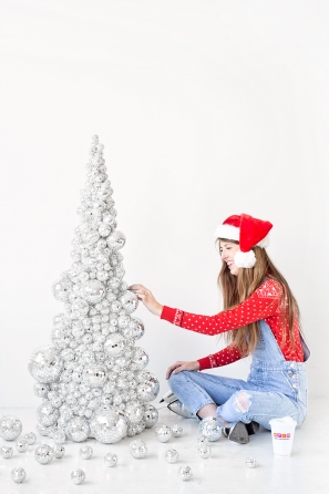 A person wearing a costume, with Christmas Tree