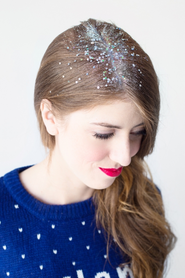 A woman with white materials in her hair