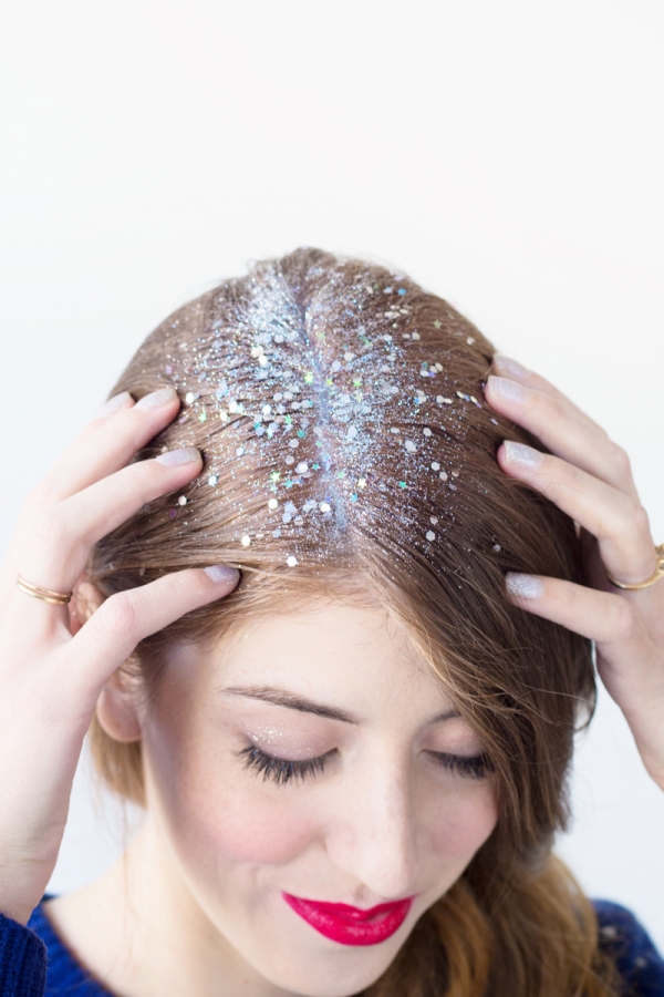 A woman with white materials in her hair