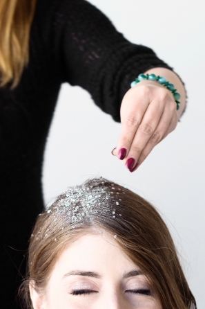 A woman with white materials in her hair