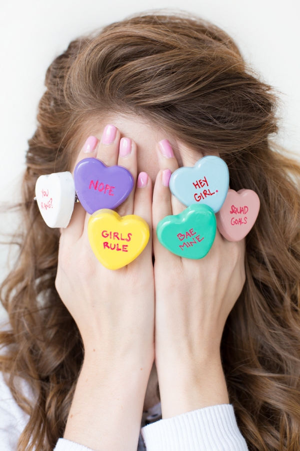 Someone wearing heart rings