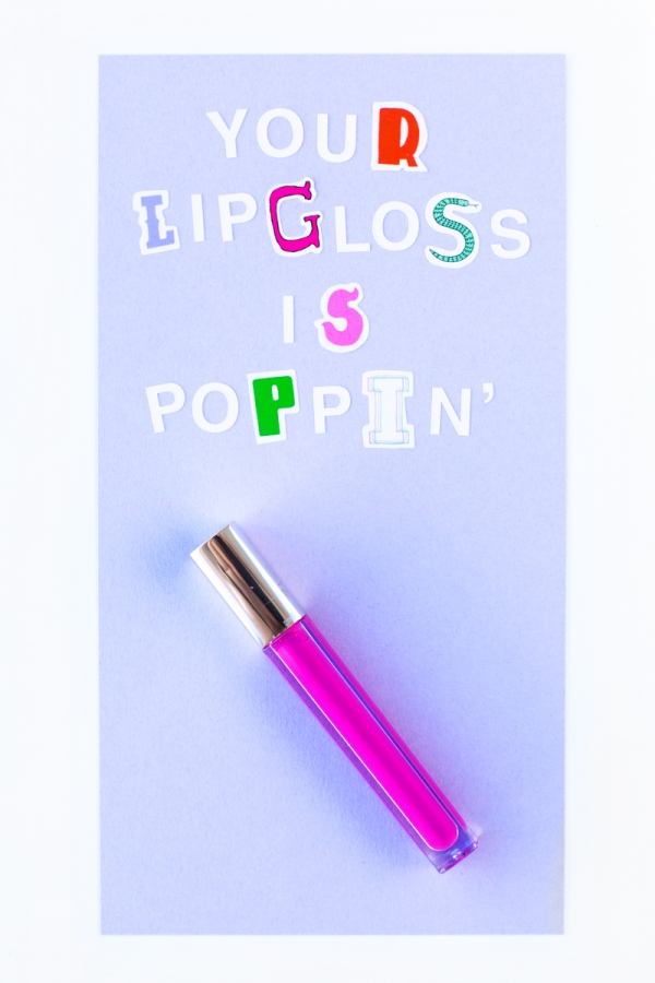 A lip gloss and cut out letters