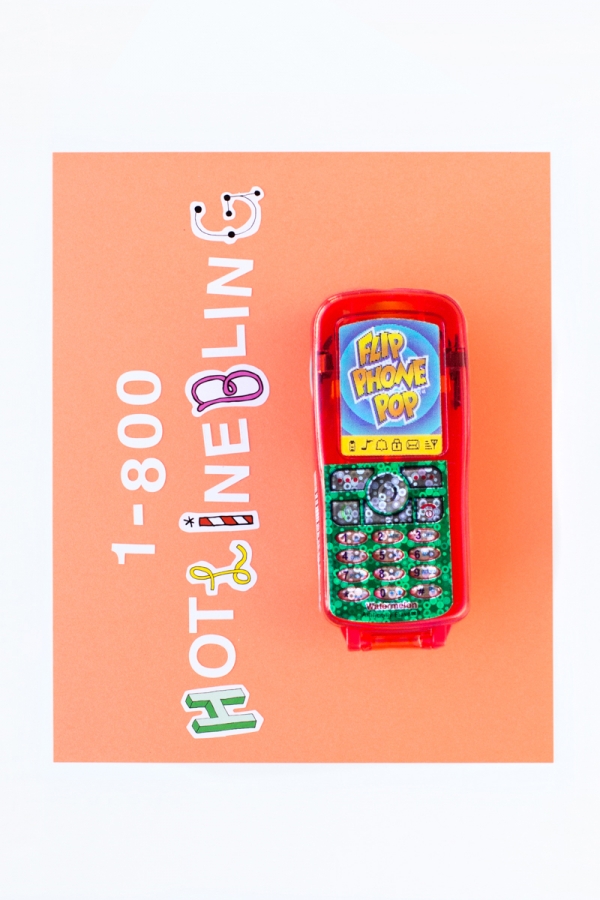 A toy phone and cut out letters