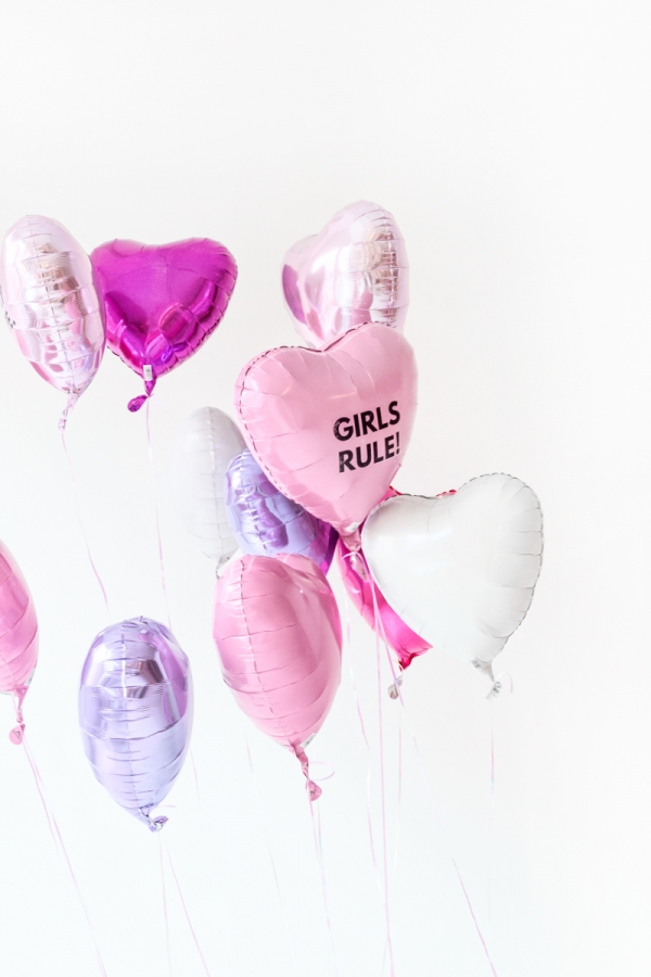 Pink, purple, and white heart shaped balloons