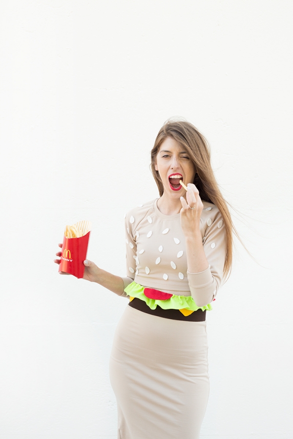 A woman wearing a hamburger costume