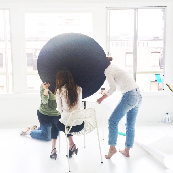 Three people staging a photoshoot 