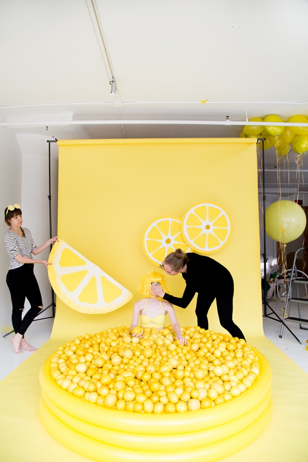 A photography set with lemons and yellow background