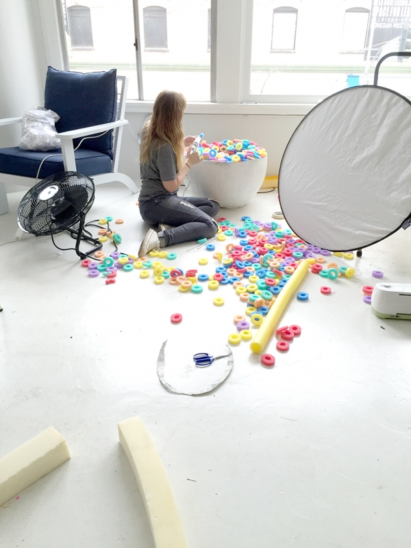 A woman sitting on the floor with toys