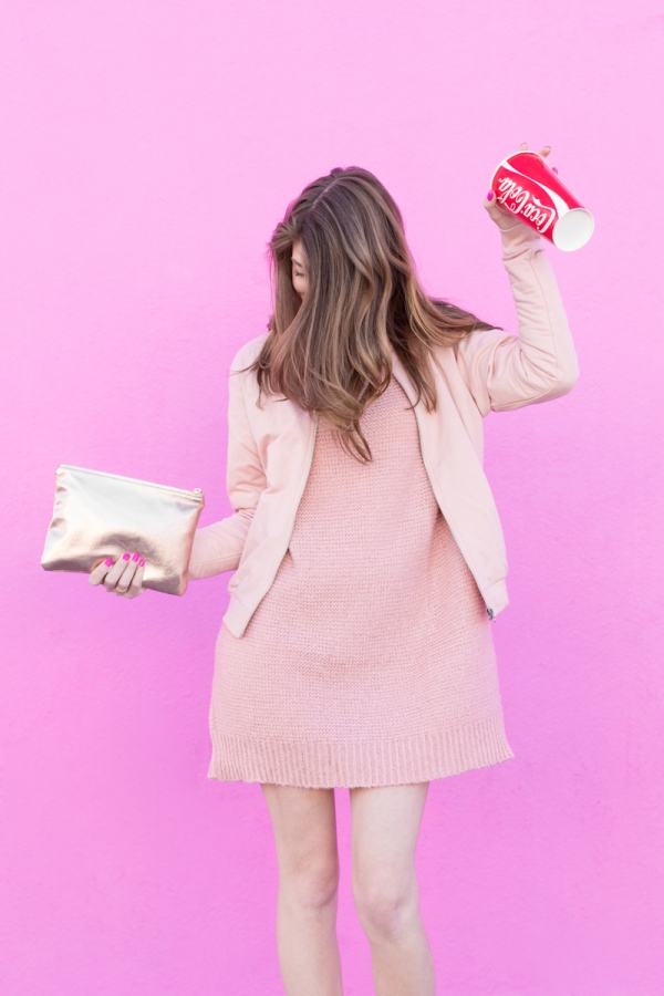 A woman wearing a pink outfit