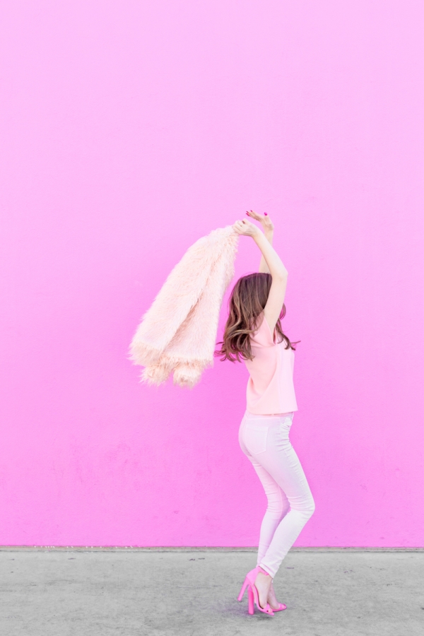 A woman wearing an all pink outfit