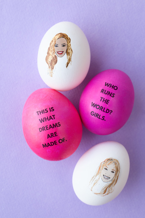 Pink and white eggs with words and faces on them