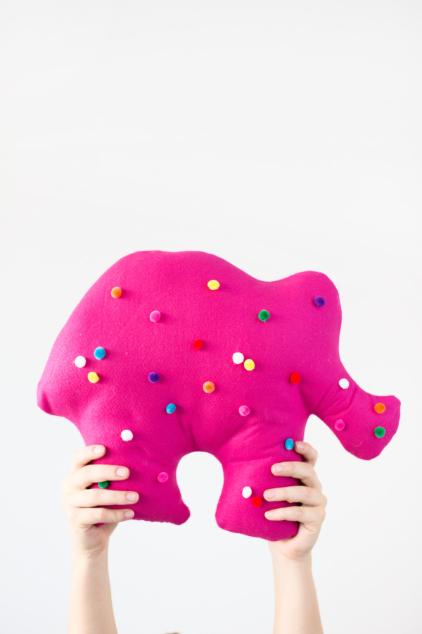 Someone holding a circus animal cookie pillows