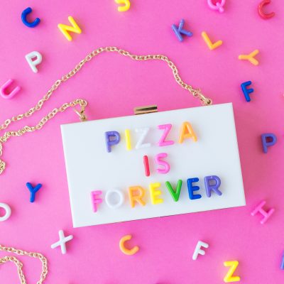 Box purse that says "pizza is forever"